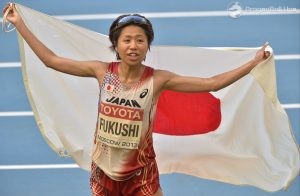 Japan's Kayoko Fukushi reacts after crossing the finish line to place third in the women's marathon final at the World Athletics Championships in the Luzhniki stadium in Moscow, Russia, Saturday, Aug. 10, 2013. (AP Photo/Martin Meissner)